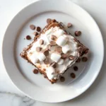 Delicious Hot Chocolate Poke Cake with Whipped Marshmallow Frosting Recipe