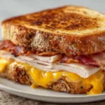 Delicious Cheddar and Bacon Turkey Melt Sandwich Recipe | Easy & Savory
